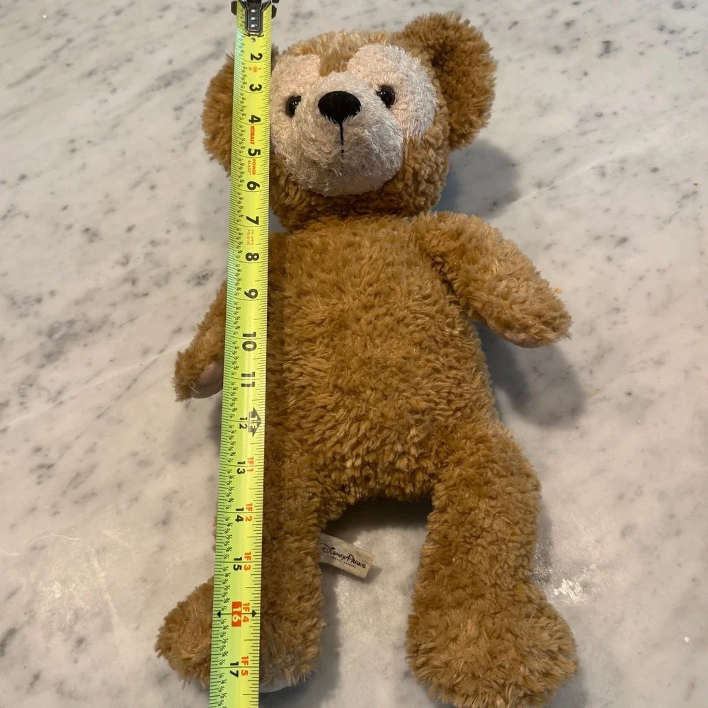 Preowned Disney Parks‎ Duffy the Disney Bear plush with original tag attached
